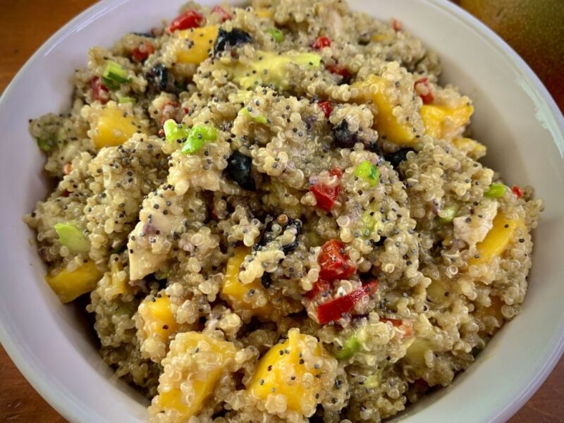 bowl with quinoa mango salad with poppyseed dressing