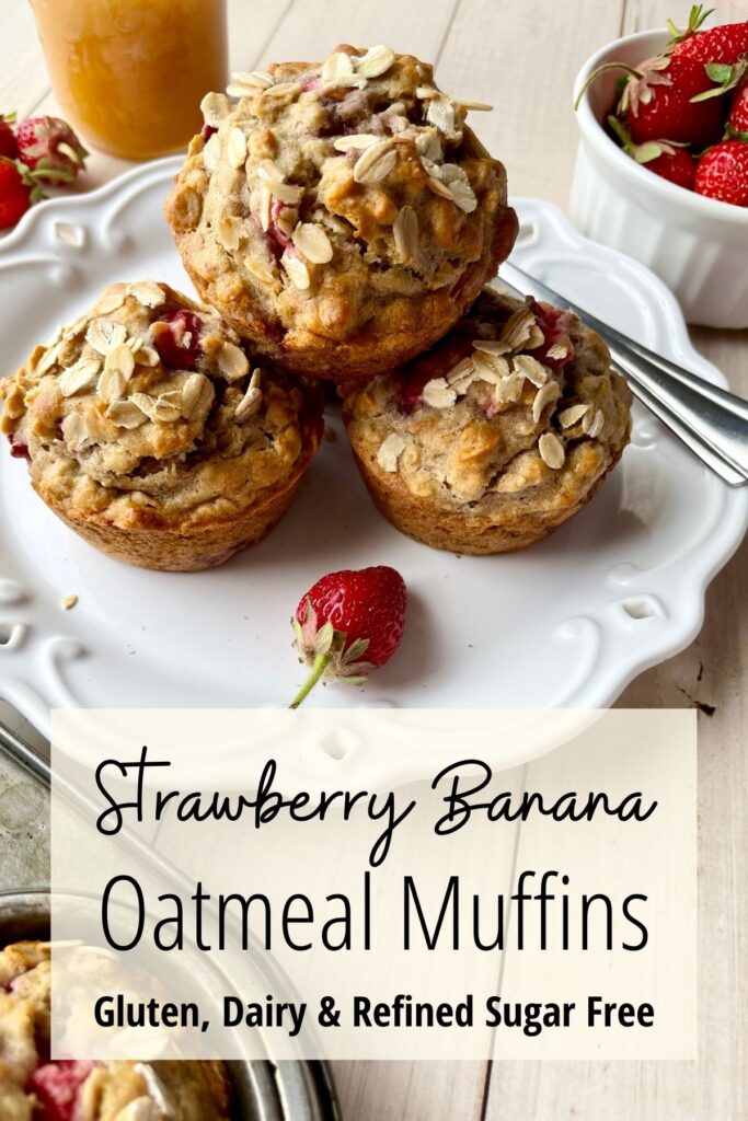 Strawberry banana oatmeal muffins stacked on white plate