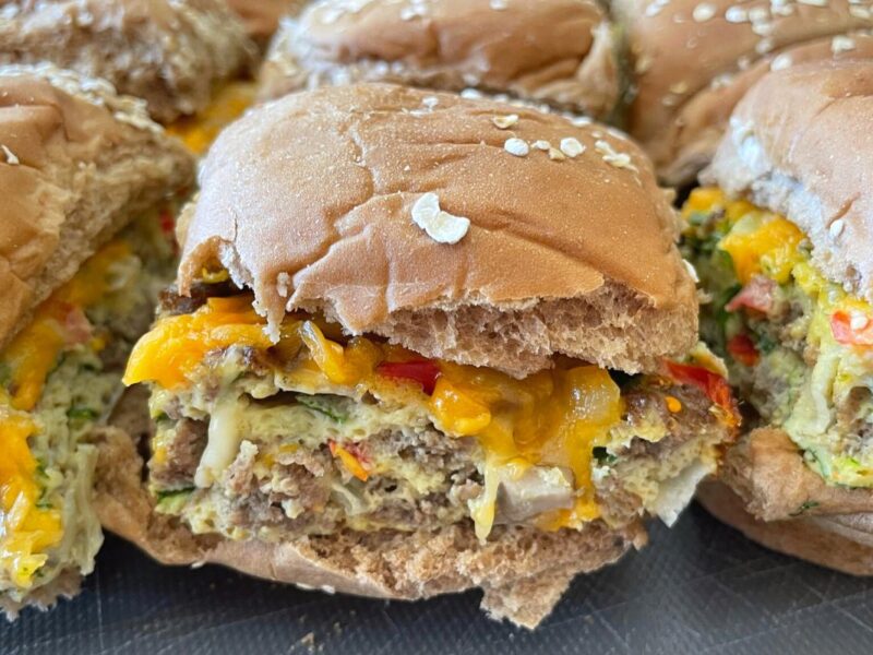 egg, veggie, and sausage inside whole wheat bun