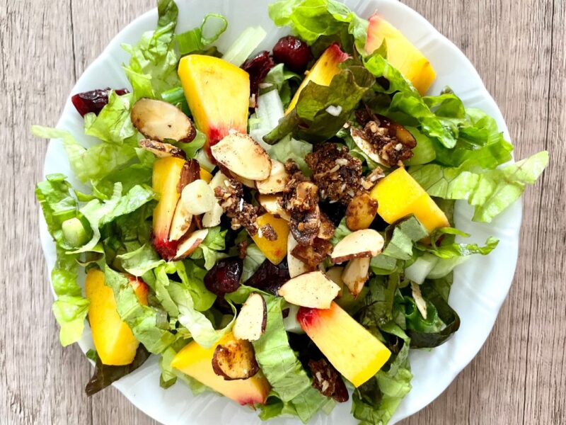 red leaf lettuce with peaches, almonds, cranberries, feta, celery, green onions