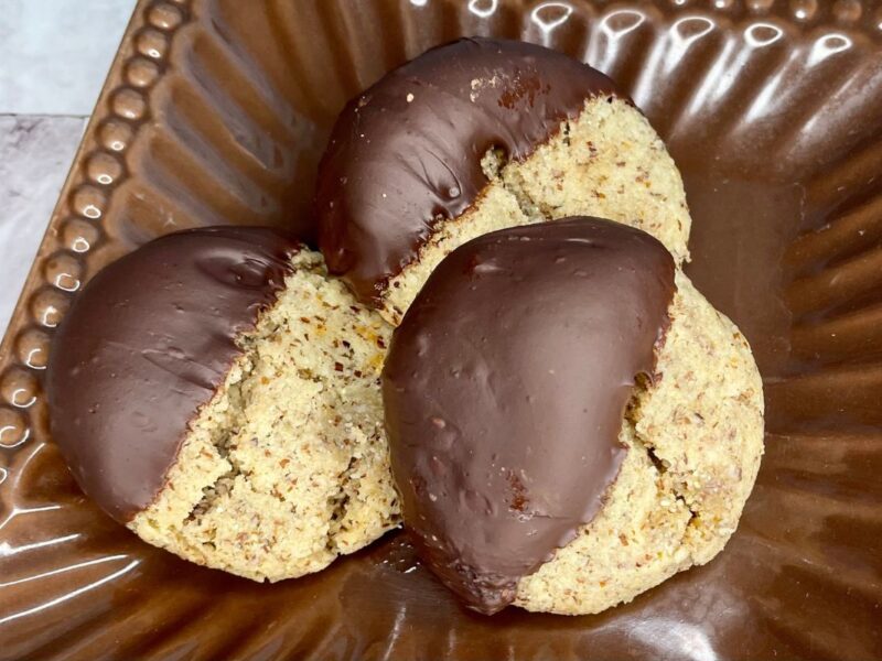 chewy almond cookies dipped in chocolate
